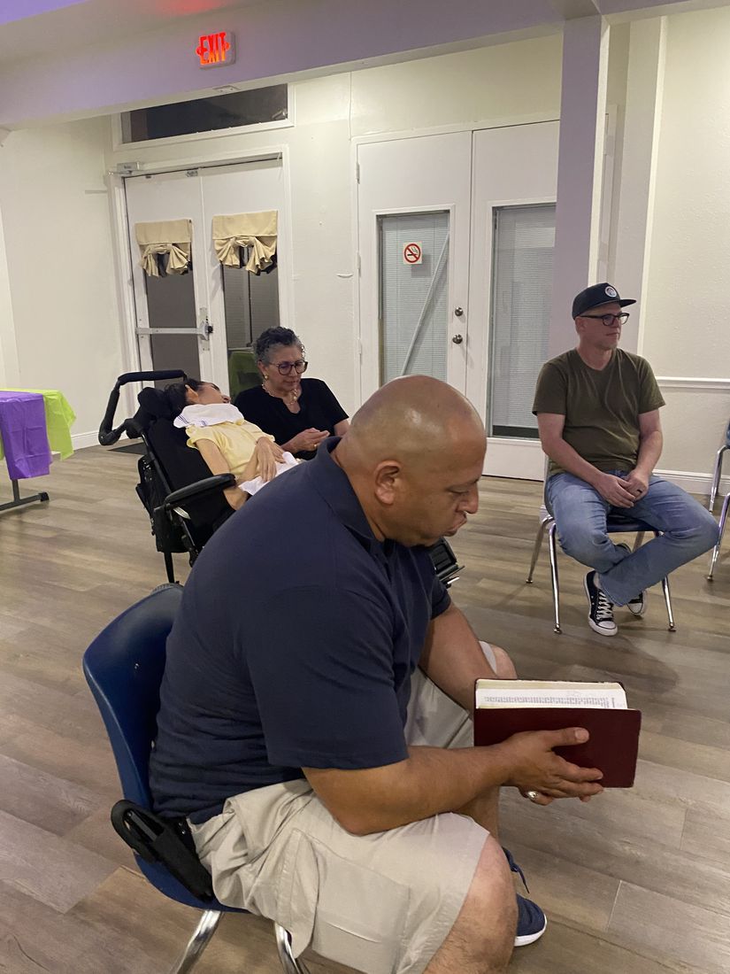 A man reading an open Bible
